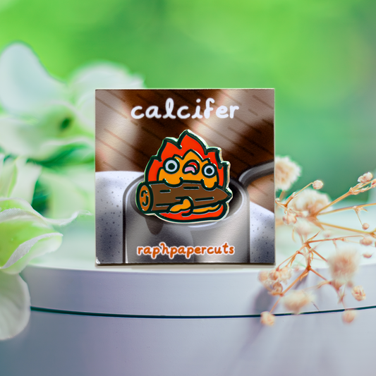 Product with 'calcifer' branding on a white surface with flowers in the background