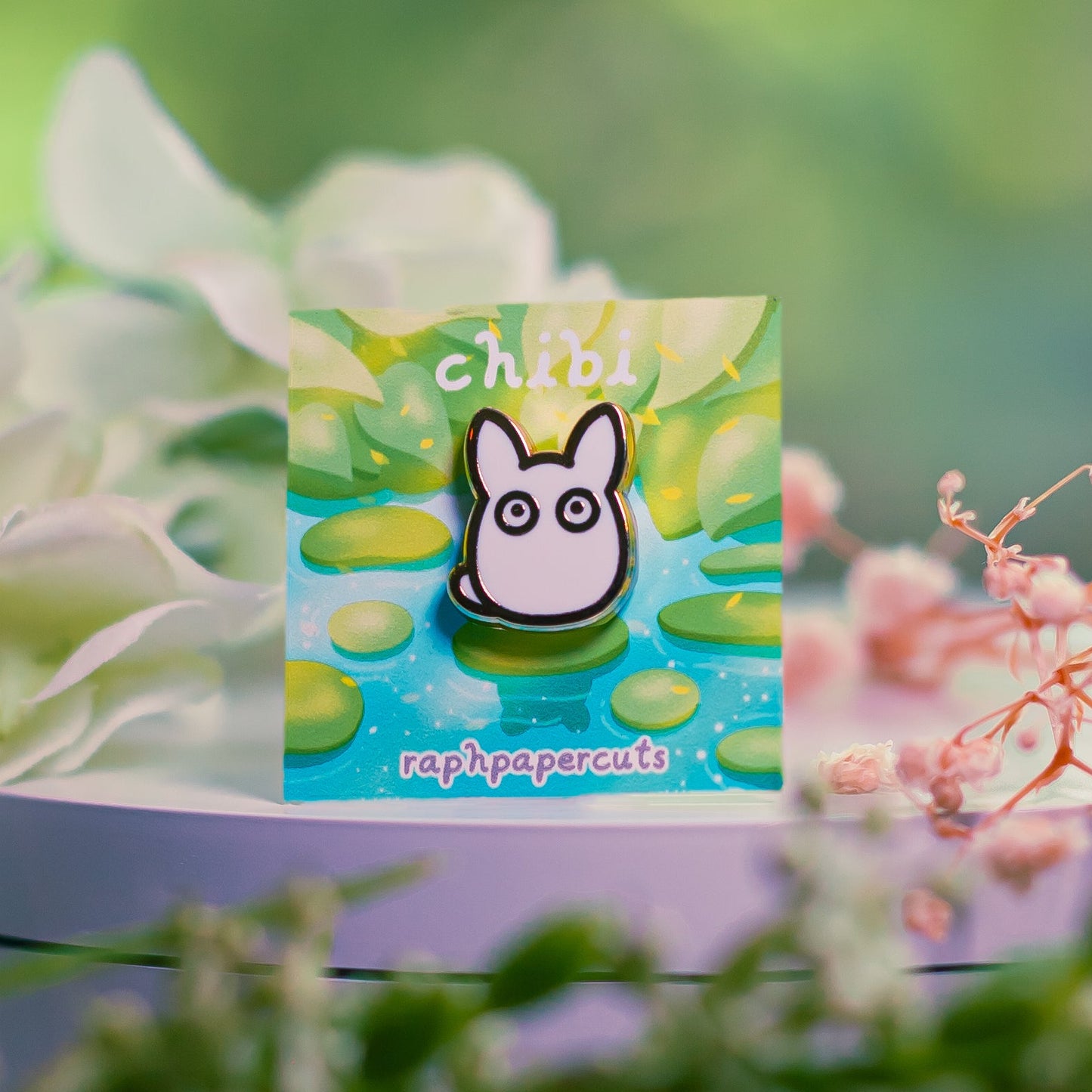 Card with a cartoon character surrounded by flowers