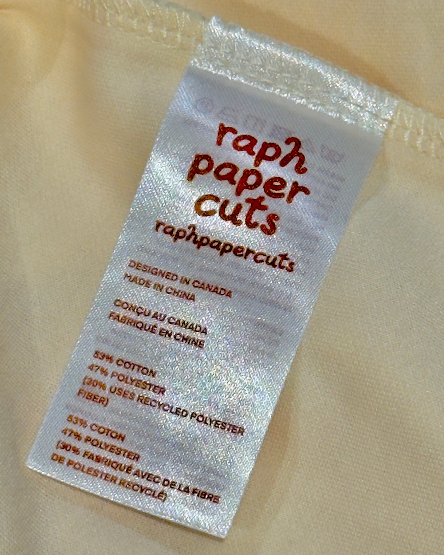 Label for raph paper Cuts on a beige fabric background