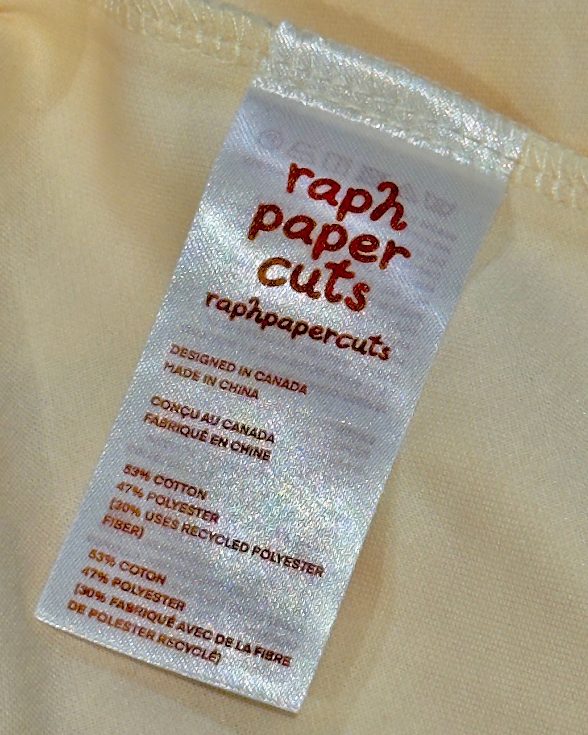Label for raph paper Cuts on a beige fabric background